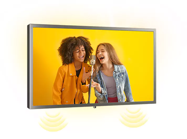 Brushed stainless steel-framed kitchen TV on a white wall shows two girls singing.